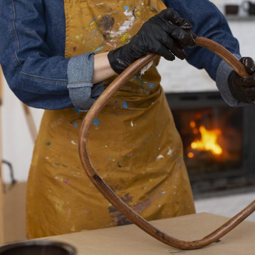 front-view-woman-restoring-wooden-furniture